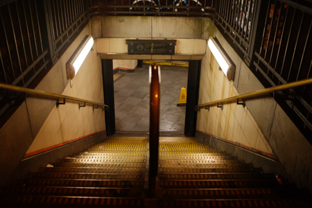 Amber-lit-stairs-of-Bethnal-Green-London-Tube-Station