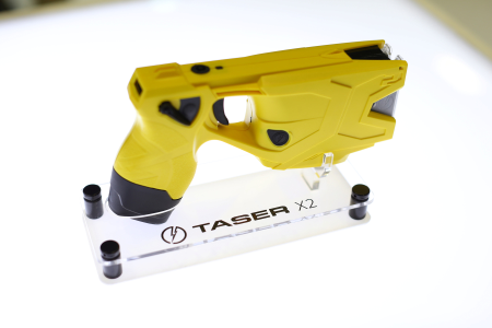 Photo of an X2 Taser gun is shown on display in the Taser booth at the International Association of Chiefs of Police conference in San Diego