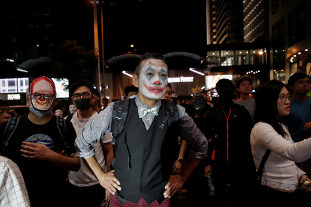 A protester in Joker makeup takes part in a Halloween march in Hong Kong on Oct. 31.