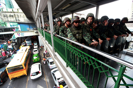 Thai soldiers guard on an overpass to prevent anti-coup demonstration in Bangkok, Thailand.