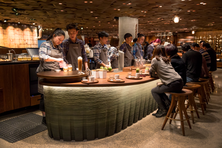 Partners work at the Teavana tea bar in the new Starbucks Roastery in Shanghai, China.