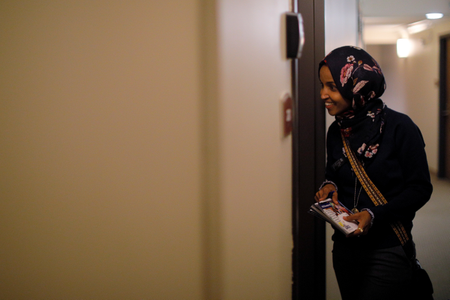 U.S. Democratic congressional candidate Ilhan Omar &quot;door knocks&quot; to encourage voters to cast ballots in the midterm elections in Minneapolis, Minnesota, U.S., October 26, 2018. Picture taken October 26, 2018.