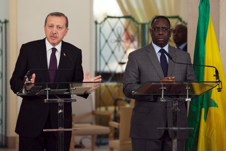 Turkey&#039;s Prime Minister Tayyip Erdogan (L) speaks to the media as Senegal&#039;s President Macky Sall looks on during a meeting between the two heads of state at the presidential palace in Dakar January 10, 2013.