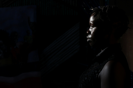 Irene Lasu, 26, a spoken word poet and member of Ana Taban, poses for a photograph in Juba, South Sudan.