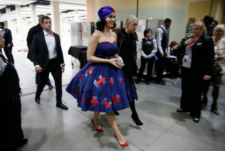 Singer Katy Perry, wearing a dress with Democratic presidential candidate Hillary Rodham Clinton&#039;s campaign logo, arrives at the Iowa Democratic Party&#039;s Jefferson-Jackson Dinner, Saturday, Oct. 24, 2015, in Des Moines, Iowa. (AP Photo/Charlie Neibergall)