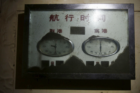 Clocks at the passengers&#039; hall are seen inside the Eastern Star cruise ship, which capsized on the Jianli section of the Yangtze River, Hubei province, June 7, 2015. The Chinese characters on top of the clocks read &quot;Voyage Schedule&quot;, &quot;Arrival&quot; and &quot;Departure.&quot;