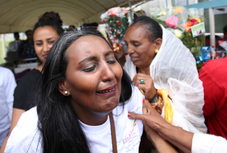 Senait Zaro, reacts as she meets her family for the first time in fifteen years, at Asmara International Airport, who arrived aboard the Ethiopian Airlines ET314 flight in Asmara, Eritrea July 18, 2018.
