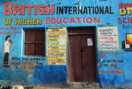 A mural illustrating educational classes is seen on the outside of a building in Wabari district of Mogadishu, Somalia, June 10, 2017.