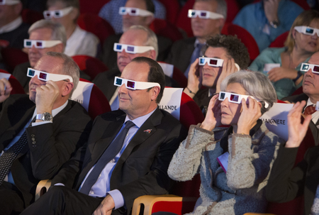 French National Centre for Space Studies (CNES) president Jean-Yves Le Gall (L) French President Francois Hollande (C) and former French astronaut Claudie Haignere wear 3D glasses during a visit at the Cite des Sciences at La Villette in Paris as they follow the successful landing of the Philae lander on comet 67P/ Churyumov-Gerasimenko, November 12, 2014. The European Space Agency&#039;s (ESA) landed a probe on a comet on Wednesday, a first in space exploration and the climax of a decade-long mission to get samples from what are the remnants of the birth of Earth&#039;s solar system.