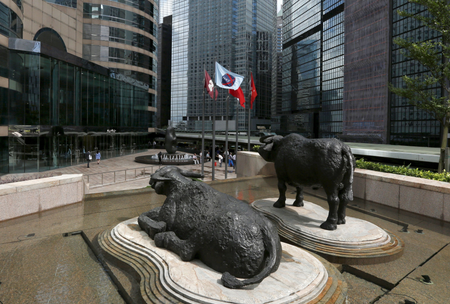 Two water buffalo sculptures by British artist Elisabeth Frink are seen outside Exchange Square business tower where the Hong Kong Stock Exchange is located
