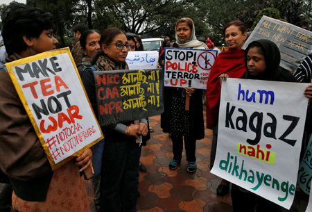 Demonstrators display placards as they attend a protest rally against a new citizenship law, in Kolkata