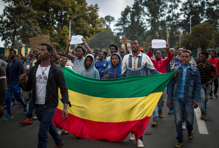 Thousands of protestors from the capital and those displaced by ethnic-based violence over the weekend in Burayu, demonstrate to demand justice from the government in Addis Ababa, Ethiopia Monday, Sept. 17, 2018. Several thousand Ethiopians have gone out onto the streets of the capital to protest ethnic-based attacks in the outskirts of the city in which more than 20 people died over the weekend. Three banners in Amharic from left to right read &quot;Justice for the people of Amhara, Tigray and Southerners&quot;, &quot;Stop ethnic-based attacks&quot; and &quot;One mouth, but two tongues&quot;.