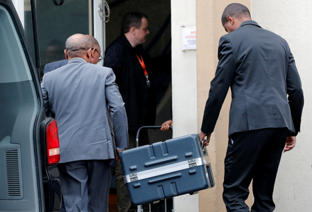 Men unload a case containing the black boxes from the crashed Ethiopian Airlines Boeing 737 MAX 8 outside the headquarters of France&#039;s BEA air accident investigation agency in Le Bourget, north of Paris, France, March 14, 2019.