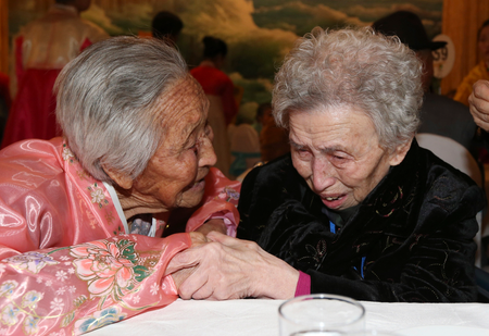 South Korean Lee Young-shil, 87, right, meets with her North Korean sister Lee Jong Shil, 84, during the Separated Family Reunion Meeting at Diamond Mountain resort in North Korea, Thursday, Feb. 20, 2014. (AP Photo/Yonhap, Lee Ji-eun) Korea Out
