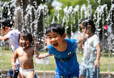 Children play in the water jets at a park near Nerima in Tokyo as temperature rose up to 39.6 degrees Celsius, the highest temperature since the start of weather information record. While central Tokyo hit the 39 degrees mark, the city of Kumagaya, north of Tokyo measured 41.1 degrees Celsius , the yet highest temperature in Japan. From the end of April to mid-July 2018, reportedly so far 21,166 people were taken to hospital for heat related problems, alone from 09 to 15 July, a total of 9,956 people were hospitalized due to suffering from the hot weather conditions, Japan&#039;s Fire and Disaster Management Agency said.