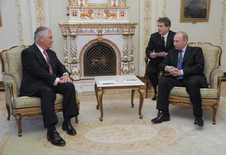 President-Elect and Russian Prime Minister Vladimir Putin (R) talks with Exxon Mobile CEO and Chairman Rex Tillerson (L) during their meeting in Moscow, Russia, 16 April 2012.