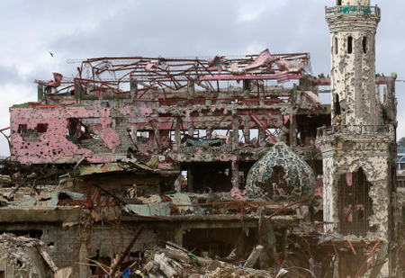Damaged houses, buildings, and a mosque are seen inside Marawi city, Philippines, October 25, 2017.