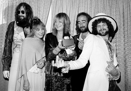 Members of the singing group Fleetwood Mac pose with their award at the American Music Awards show in Santa Monica, Ca., Jan. 16, 1978. The group was named favorite pop group and &quot;Rumours&quot; was named favorite album in the pop category. Posing from left are, Mick Fleetwood, wearing sunglasses; Stevie Nicks; Christine McVie; John McVie; and Lindsey Buckingham. (AP Photo/Nick Ut)