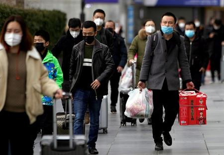 Street scene in China showing people wearing face masks, amid the coronavirus epidemic