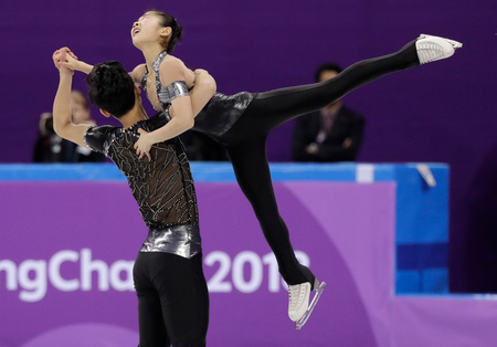 Ryom Tae Ok and Kim Ju Sik of North Korea perform in the pair figure skating short program in the Gangneung Ice Arena at the 2018 Winter Olympics in Gangneung, South Korea, Wednesday, Feb. 14, 2018. (AP Photo/David J. Phillip)