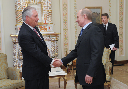President-Elect and Russian Prime Minister Vladimir Putin (2-R) shakes hands with Exxon Mobile CEO and Chairman Rex Tillerson (L) during their meeting in Moscow, Russia, 16 April 2012.