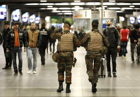 Belgian soldiers patrol in the arrival hall at Midi railway station in Brussels, November 21, 2015, after security was tightened in Belgium following the fatal attacks in Paris. Belgium raised the alert status for its capital Brussels to the highest level on Saturday, shutting the metro and warning the public to avoid crowds because of a &quot;serious and imminent&quot; threat of an attack.