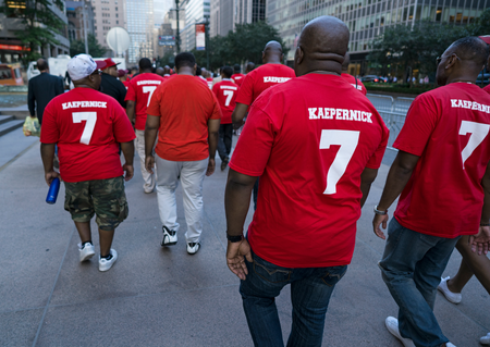 Supporters of unsigned NFL quarterback Colin Kaepernick arrive for a rally Wednesday, Aug. 23, 2017, near NFL headquarters in New York. (AP Photo/Craig Ruttle)