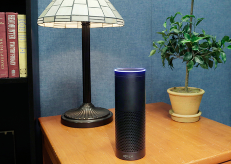 FILE - This July 29, 2015 file photo made in New York shows Amazon&#039;s Echo, a digital assistant that continually listens for commands such as for a song, a sports score or the weather. The company says Echo transmits nothing to Amazon’s data centers until you first say “Alexa” or press a button. A blue light also comes on to let you know it’s active. (AP Photo/Mark Lennihan, File)