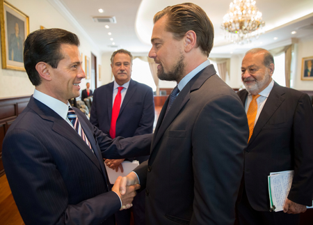 Mexico&#039;s President Enrique Pena Nieto shakes hands with actor Leonardo DiCaprio as tycoon Carlos Slim looks on