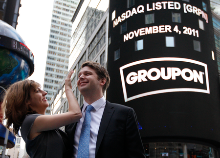 Groupon Chief Executive Andrew Mason poses with his wife Jenny Gillespie outside the Nasdaq Market following his company&#039;s IPO in New York November 4, 2011.