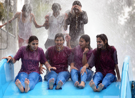 Young girls play in a water park in Bhopal.