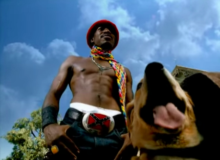 Andre 300 wearing a Confederate flag belt buckle