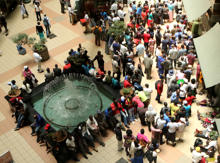 People queue to withdraw money from a bank in Harare, Zimbabwe&#039;s capital, March 8, 2017.