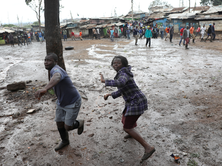 Opposition supporters throw stones at police during clashes in Kibera slum in Nairobi, Kenya October 26, 2017.