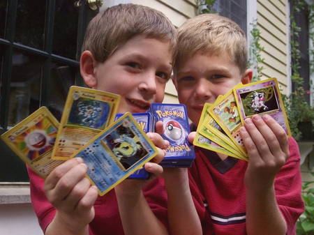 Tyler, right, and his friend George, both six of Scituate, Mass., hold up their favorite Pokemon trading cards, in Scituate, Thursday, Sept. 9, 1999.