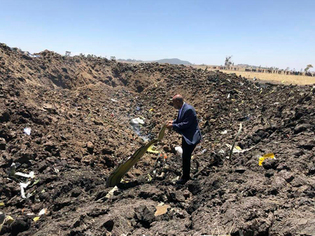 In this photo taken from the Ethiopian Airlines Facebook page, the CEO of Ethiopian Airlines, Tewolde Gebremariam, looks at the wreckage of the plane that crashed shortly after takeoff from Addis Ababa, Ethiopia, Sunday March 10, 2019. An Ethiopian Airlines flight crashed shortly after takeoff from Ethiopia&#039;s capital on Sunday morning, killing all 157 people thought to be on board, the airline and state broadcaster said, as anxious families rushed to airports in Addis Ababa and the destination, Nairobi.