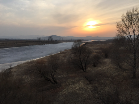 The frozen Tumen river separating North Korea (L) from China is seen in this photo taken from the Chinese border city of Hunchun, China, March 18, 2015. It&#039;s much more dangerous, and twice as expensive, to defect from North Korea since Kim Jong Un took power in Pyongyang three and a half years ago, refugees and experts say, and far fewer people are escaping from the repressive and impoverished country. With barbed-wire fencing erected on both sides of the Tumen River that marks the border with China, more guard posts and closer monitoring of cross-border phone calls, the number of North Koreans coming annually to the South via China has halved since 2011. Picture taken on March 18, 2015.