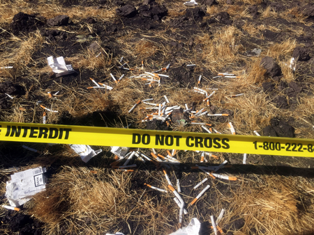 Cigarettes are seen on a cordon line at the scene of the Ethiopian Airlines Flight ET 302 plane crash, near the town of Bishoftu, southeast of Addis Ababa, Ethiopia March 10, 2019.