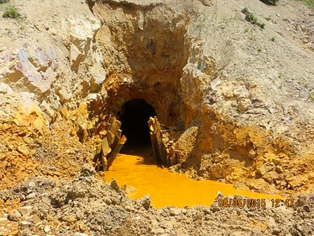 Yellow mine waste water is seen at the entrance to the Gold King Mine in San Juan County, Colorado.