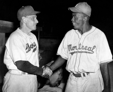 Jackie Robinson, Montreal Royals&#039; first baseman, is shown shaking hands with Brooklyn Dodger manager Leo Durocher in March 1947 in Havana, Cuba, where the Dodgers and Royals played an exhibition game.