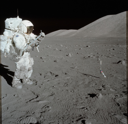 AS17-134-20426 (11 Dec. 1972) --- Scientist-astronaut Harrison H. Schmitt collects lunar rake samples at Station 1 during the first Apollo 17 extravehicular activity (EVA) at the Taurus-Littrow landing site. This picture was taken by astronaut Eugene A. Cernan, Apollo 17 commander. Schmitt is the lunar module pilot. The Lunar Rake, an Apollo Lunar Geology Hand Tool, is used to collect discrete samples of rocks and rock chips ranging in size from one-half inch (1.3 cm) to one inch (2.5 cm).