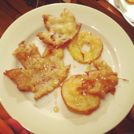fried apples and leaves on a plate