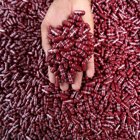 A police officer displays seized Parvon Spas capsules, a type of analgesic and anti-spasmodic, in Jammu July 28, 2009. Police said on Tuesday their men recovered 20,000 capsules from three drug peddlers during a routine search at a police check post on the outskirts of Jammu.