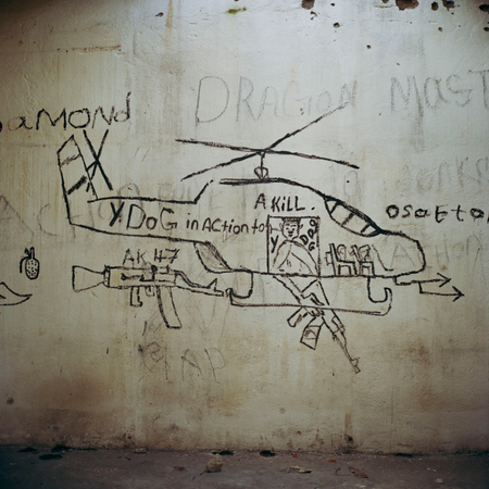 LIBERIA. 2004. War graffiti left during the various parts of the Liberian civil war.