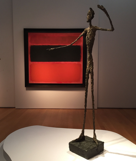 Alberto Giacometti&#039;s &quot;L&#039;homme au doigt&quot; with Mark Rothko&#039;s &quot;No. 36 (Black Stripe)&quot; in the background