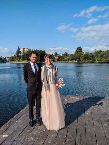 A photo taken of the couple by the lake.