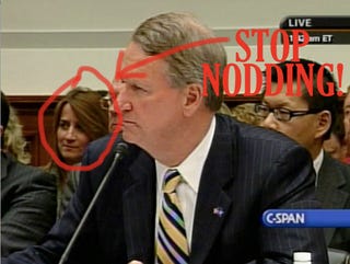 Illustration for article titled To The Woman Sitting Behind Rick Wagoner at the House Financial Services Committee Hearing...