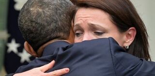 President Obama and parent of Newtown, Conn., shooting victim (Jewel Samad/AFP/Getty Images)