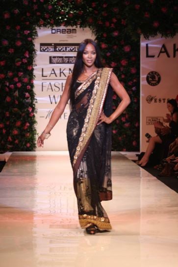 Illustration for article titled Naomi Rocks Saris In Mumbai; First American Woman In Space Shilling For Louis Vuitton