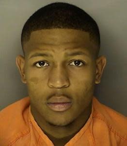 Ray Lewis III, 20, is seen in a mugshot taken after he turned himself in on charges of criminal sexual conduct.